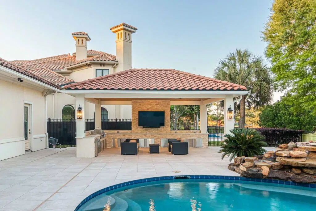 Tuscan inspired detached hip-style patio cover.